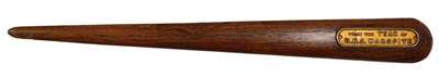 Lot 588 - A teak letter opener, with metal plaque from...