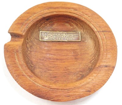 Lot 589 - An early 20thC teak ash tray, with metal...