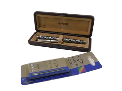 Lot 596 - A Parker fountain pen, in black and silvered...