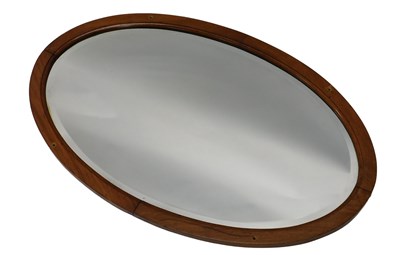 Lot 813 - An early 20thC oval mirror, with bevelled...