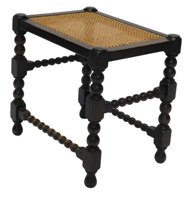 Lot 816 - A 1920s oak bergere topped stool, with bobbin...