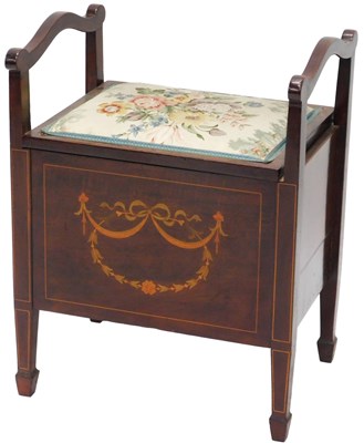 Lot 818 - An Edwardian mahogany piano stool, with scroll...