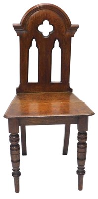 Lot 821 - A late 19thC Gothic style oak hall chair, with...