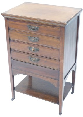 Lot 832 - An Edwardian walnut music Canterbury, with...