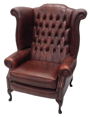 Lot 868 - An 18thC style wing armchair, of large...