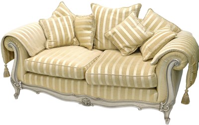 Lot 873 - A three seater settee, with cushions and...