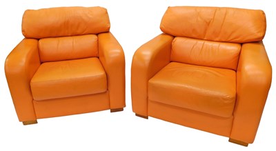 Lot 874 - Two deep seated armchairs, in tangerine...