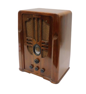 Lot 1019 - A mid 20thC walnut cased Philco tombstone...