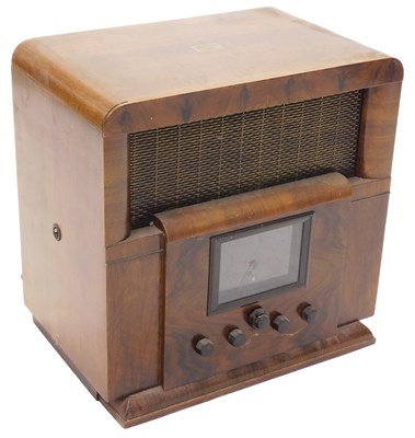 Lot 1053 - A mid 20thC walnut cased HMV radio, with front...