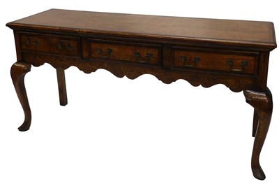 Lot 1068 - An 18thC style oak dresser base, with a wide...