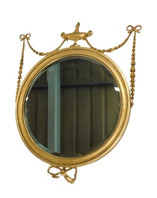 Lot 1086 - A Neoclassical Adam design wall mirror, the...