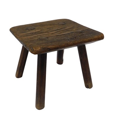 Lot 1087 - A late 19thC elm milking stool, of square form,...