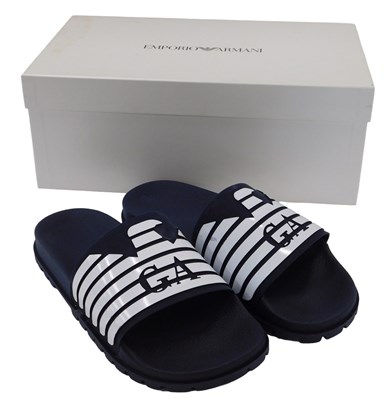 Lot 1115 - A pair of Emporio Armani flip flops, GA white...