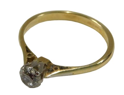 Lot 1155 - A solitaire ring, set with small white stone,...